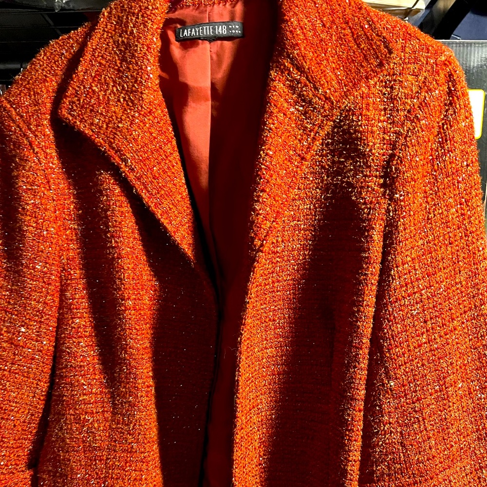 3/4 sleeve jacket with gold threads running through it.
